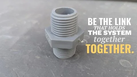 A high angle perspective displays a grey plastic threaded nipple pipe fitti.. Stock Photos