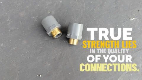 A high angle perspective displays two threaded pipe fittings set against a .. Stock Photos