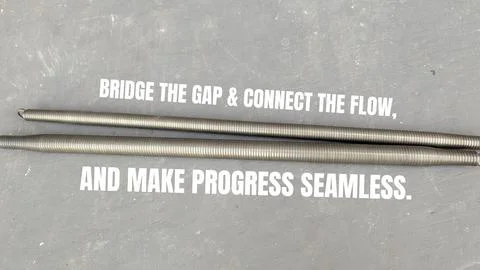 A high angle perspective displays two long metal spring pipe bender tools s.. Stock Photos