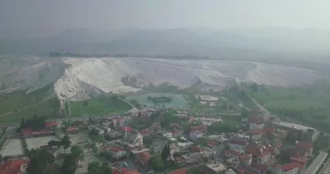 High Angle Perspective of Pamukkale Mineral Cliffs, Turquoise Lake Stock Footage 340378477