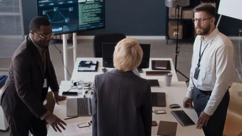 High Angle Portrait of Diverse Cybersecurity Engineers Meeting in Control Center Stock Footage 334934840