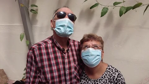 High Angle Portrait of a latin elderly senior couple wearing face mask pandemic Stock Footage 147570500