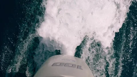 High-angle pov of motorboat engine leaving sea water wake slow motion Stock Footage 278952647