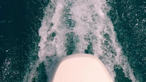 High-angle pov of motorboat engine leaving sea water wake slow motion Stock Footage 278952759
