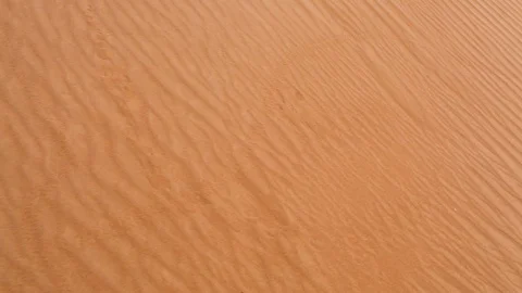 High angle POV walk on dry sand dunes in Sahara desert Stockbeeldmateriaal 129777883