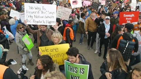 High Angle Protesters Marching with Anti Gun Signs Stock Footage 87636453