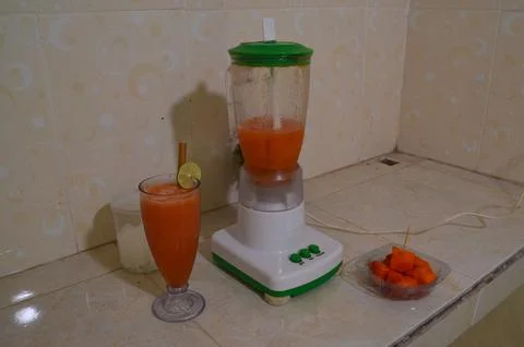 High Angle Quarter Left Perspective of Fresh Papaya Smoothie Stock Photos