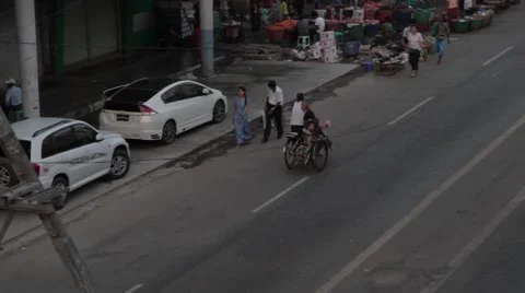 High Angle of Rickshaw along Asian Street (Burma/Yangon) Stock Footage 56632467