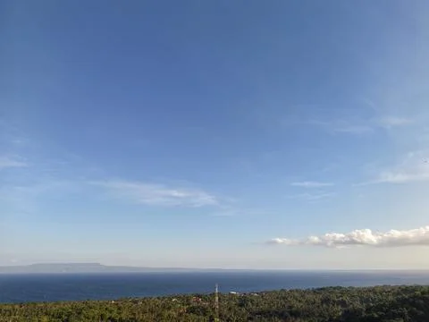 High angle scenic view of blue ocean strait and distant island Stock Photos