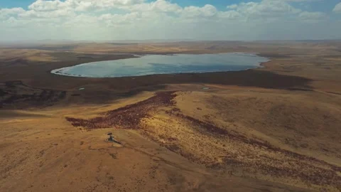 High Angle Scenic View of a Large Lake and Desolate Hills China Stock Footage 346334534