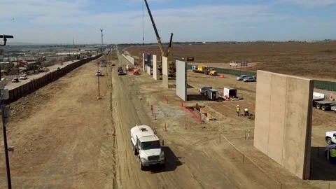 High Angle of a Section of The U.S. Border Wall Construction Stock Footage 130588675