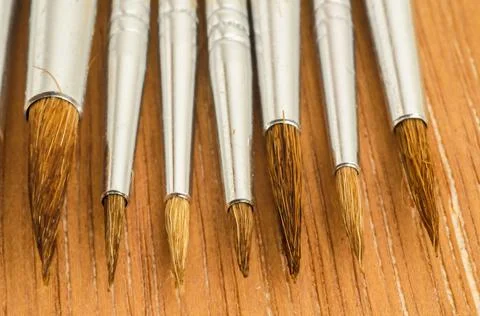 High angle selective focus of different size paint brushes Stock Photos