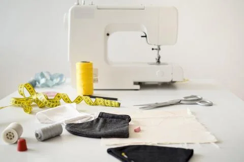 High angle sewing machine with measuring tape face masks Stock Photos