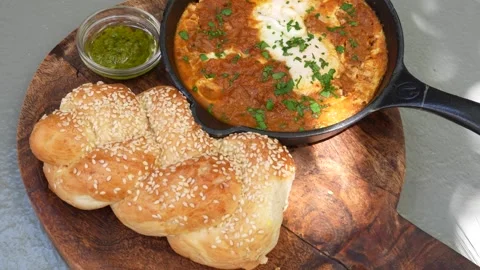 High Angle Shakshuka With Sesame Bread and Herb Sauce Stock Footage 341827084