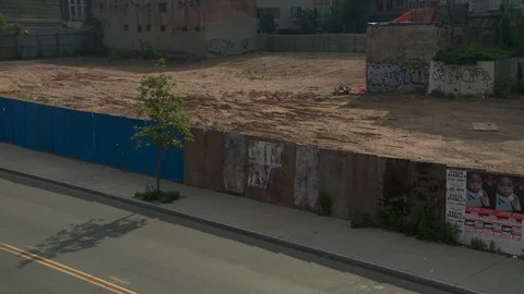 High angle shot of abandoned dirt lot with view of crosswalk light, day. Vídeo Stock 108921302