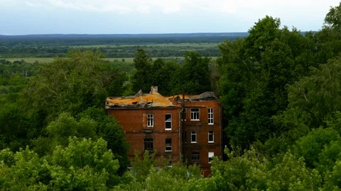High angle shot of an abandoned house in the middle of a forest Stock Footage 98381789