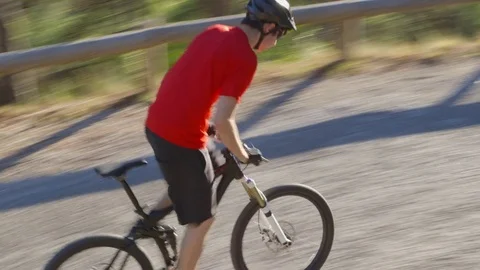 High-angle shot of an athletic guy on a mountain bike - ProRes Stock-Footage 73452388