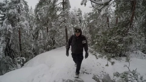 High angle shot of a backpacker walking towards camera Stock Footage 145950056