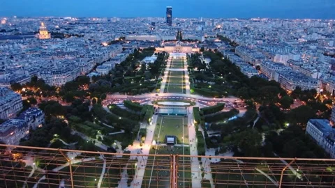 High angle shot of a beautiful park in Paris, France at dusk with lights shining Stock Footage 158604803