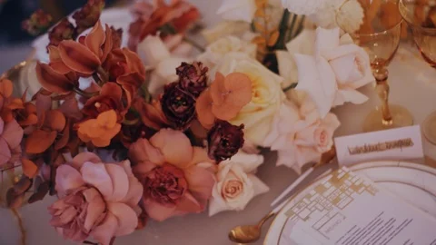 High angle shot of beautiful wedding bouquet on the decirated dining table. Stock Footage 98739931