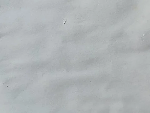 High-angle shot of a blank, off-white recycled paper surface. Photos