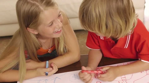 High angle shot of brother and sister coloring together. Stock Footage 43639460