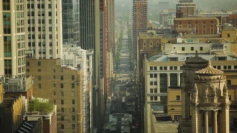 High angle shot of buildings and traffic on the streets of Chicago Stock Footage 97101380
