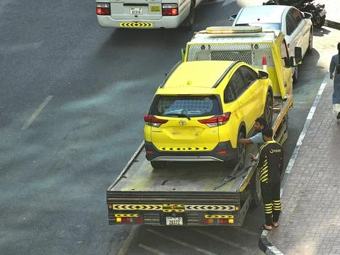 High-angle shot captures a bright yellow car Stock Photos