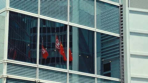A high-angle shot captures the modern multi-story building with grid-like large Stock Footage 338311474