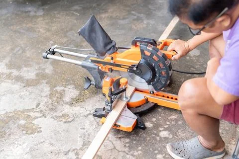 High-angle shot capturing a person using an electric orange and black slidi.. Stock Photos