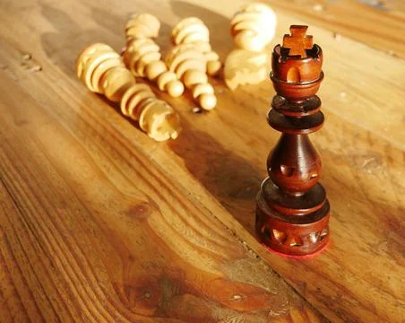 High angle shot of chess figures on the wooden surface Stock Photos