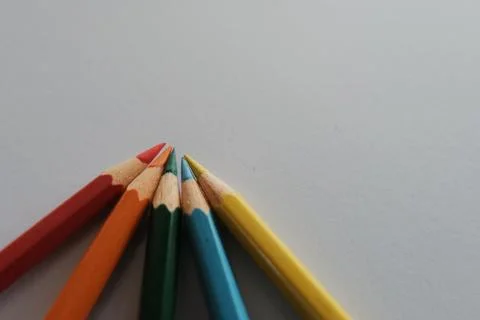 High angle shot of colorful sharp pencils on a white surface 스톡 사진