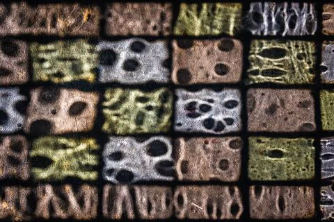 High angle shot of a colorful window glass shadow on the ground Stock Photos