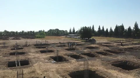High Angle Shot of Construction Crew Working on Building Foundation Grid and Stock Footage 339095457