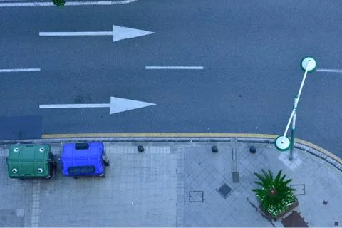 High angle shot of the corner of the sidewalk and the asphalt street Stock Photos