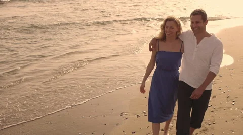 High angle shot of couple walking on beach. Stock Footage 43653470