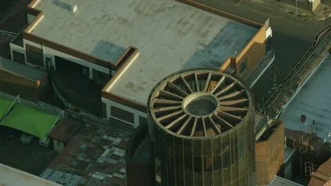 High angle shot of a cylindrical glass feature on a building Stock Footage 79479059