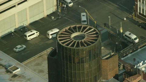High angle shot of a cylindrical glass feature on a building Stock Footage 79664770