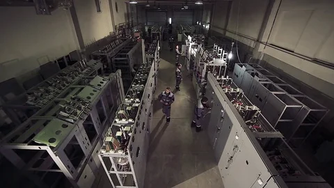 High-angle shot of factory workers working with electric meters. Stock-Footage 77108113