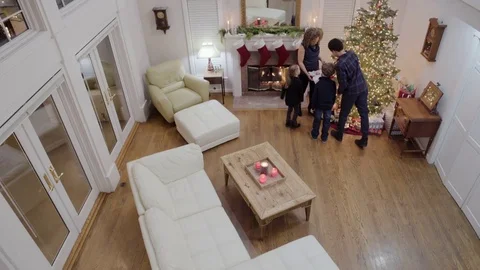 High-angle shot of a father coming home at Christmas 動画素材 73036377
