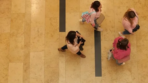 High-angle shot of four people sitting on a polished wooden floor Video stock 333281575