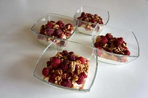A high angle shot of four square bowls arranged in a neat cross pattern with  Stock Photos