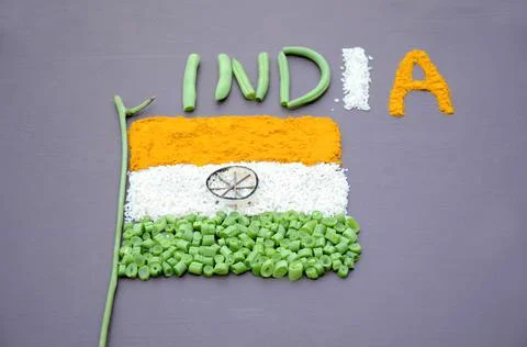 A high angle shot of the Indian flag and word India made of orange turmeric,  Stock Photos