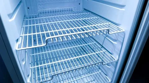 High angle shot inside an empty clean refrigerator showcasing multiple tier.. Stock Photos