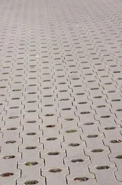 High angle shot of interlocking paver block  with holes 스톡 사진