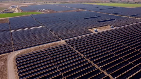 High-angle shot of large solar farms covering wide open areas Video stock 346066150