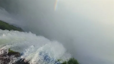 High angle shot looking down at Devil's Throat waterfall drop with dense mist Stock Footage 328910758