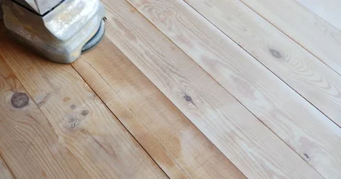 A high angle shot of a man sanding a parquet Stock Footage 55327783