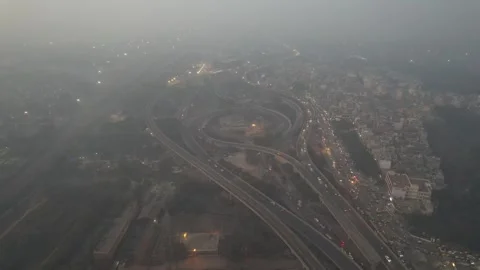 High-angle shot of a metropolitan road network shrouded in smog. Stock-Footage 330154262