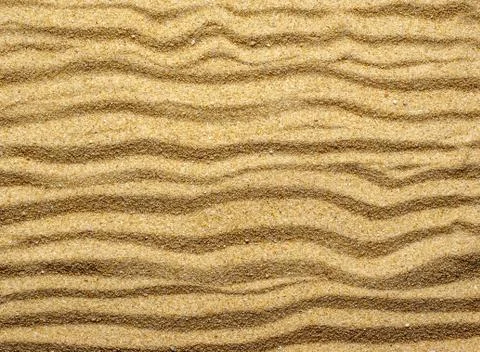 High angle shot of the patterns and lines on a sand-covered surface Fotos de archivo